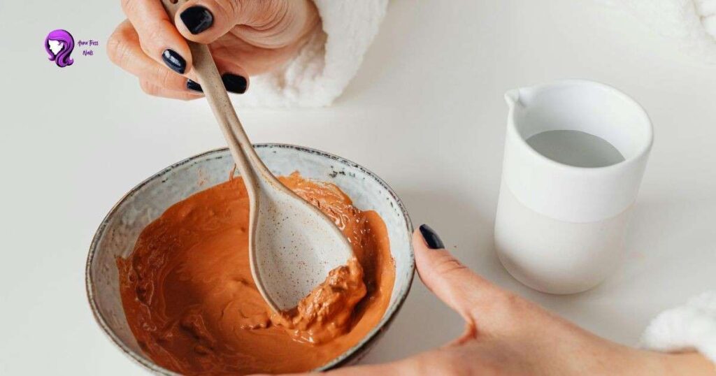 Avocado and honey mask ingredient in a bowl for a DIY hair moisturizing treatment