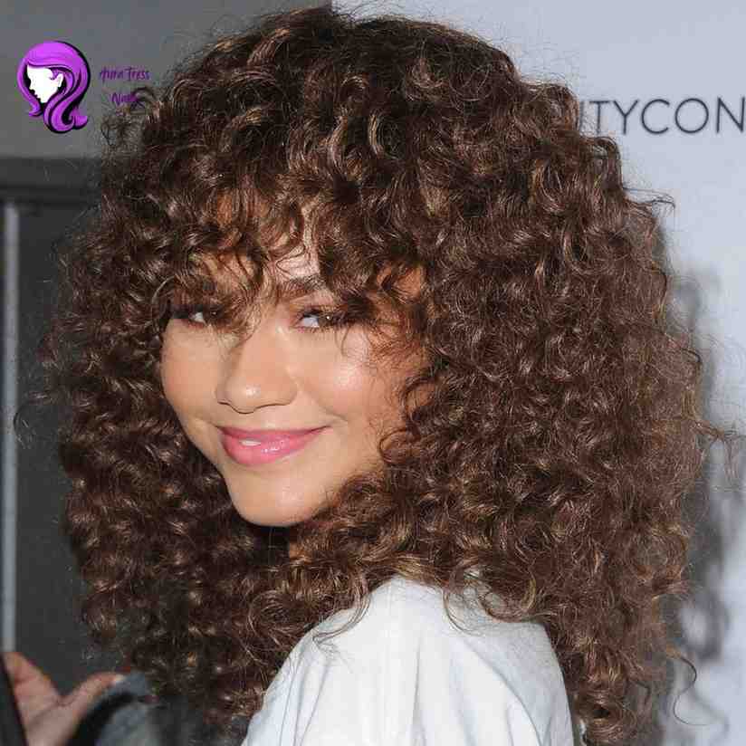 Zendaya curly shag hairstyle with defined, voluminous curls