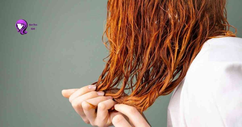 Person applying deep conditioner to hair for winter hydration
