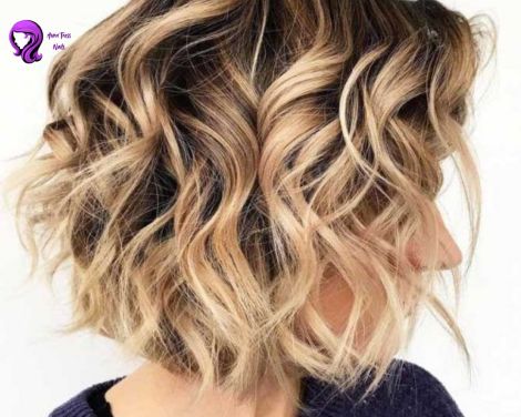 Casual beach wave with a tousled, sun-kissed look on shoulder-length hair.