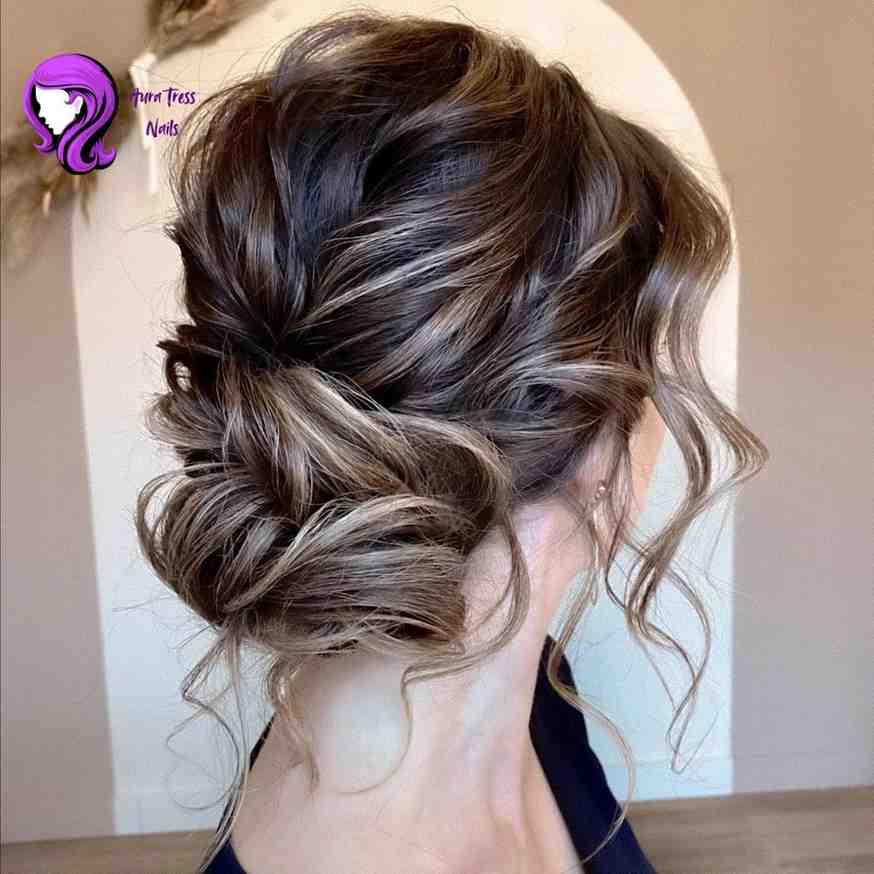 Woman with a sleek, low chignon hairstyle, perfect for formal or casual evening events