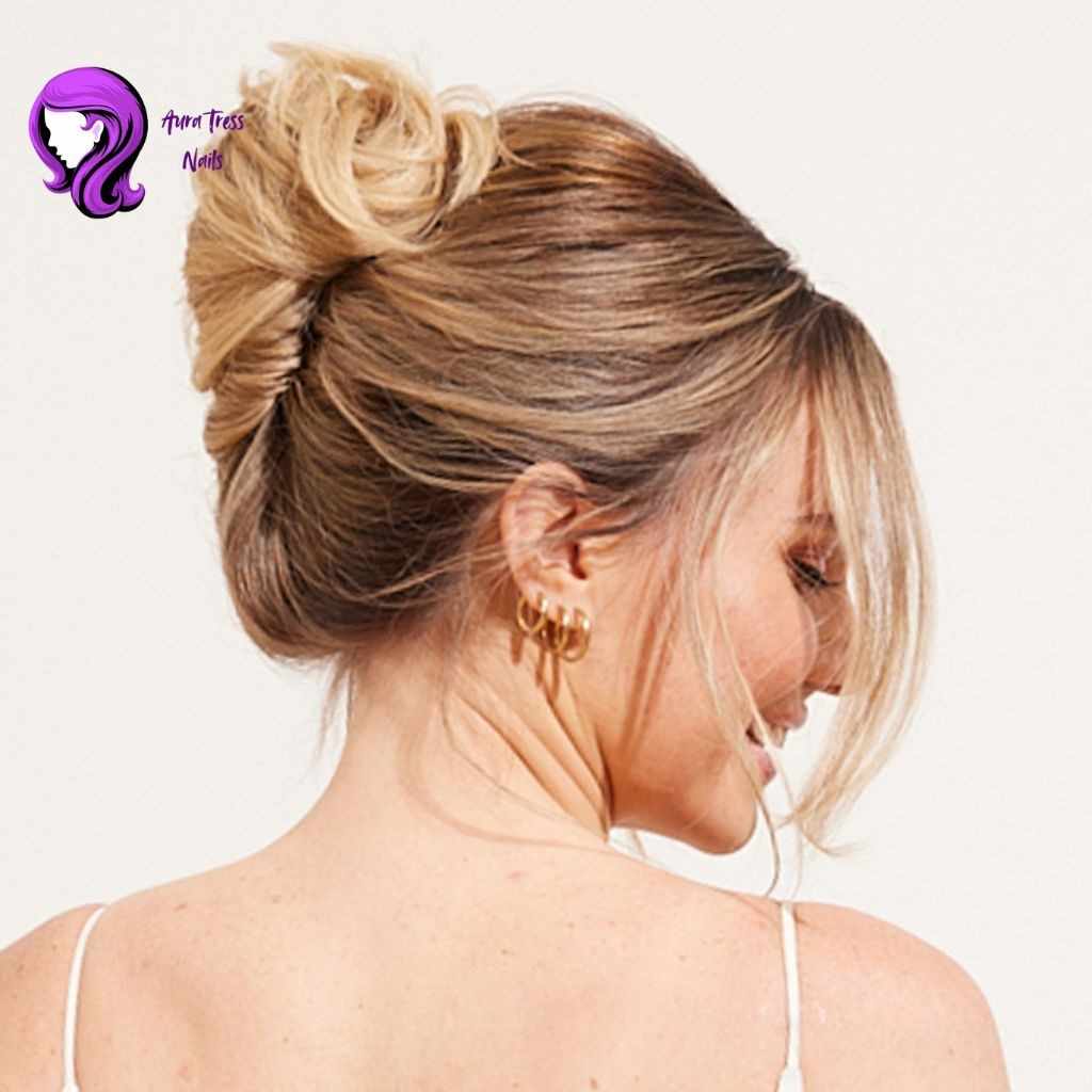 Woman wearing a sleek French twist updo, ideal for a formal night out or upscale event