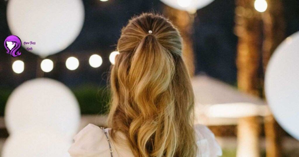 Girl with a classic half-up, half-down hairstyle secured with a bow