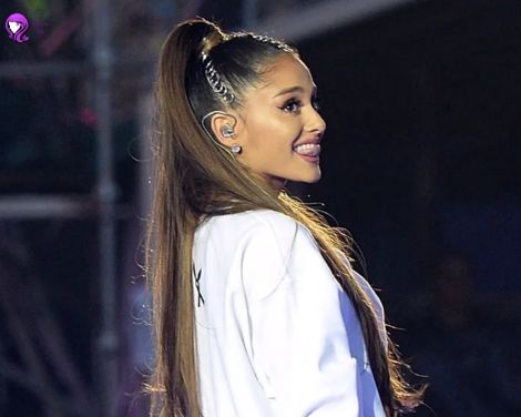 A close-up of a sleek high ponytail inspired by Ariana Grande, with hair wrapped around the base for a polished finish.
