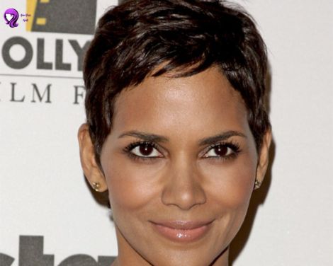 A bold and edgy pixie cut inspired by Halle Berry, featuring short, textured layers for a sleek and modern look.