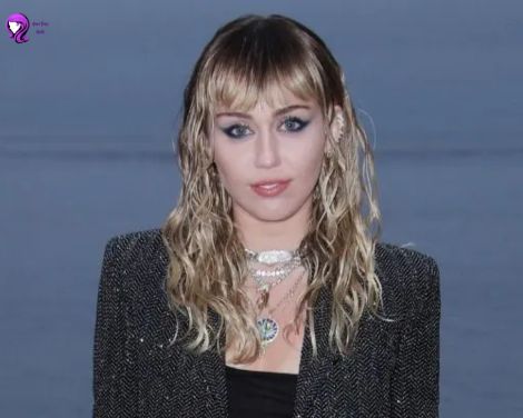 A bold shag haircut inspired by Miley Cyruss, featuring layered, tousled strands for a rocker chic look.