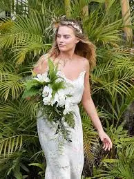 Margot Robbie-inspired braided crown updo, perfect for weddings and outdoor events.