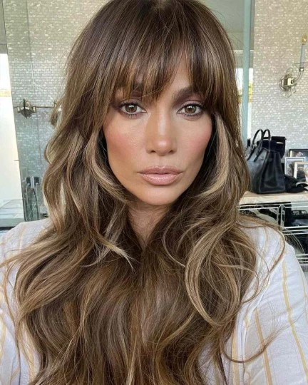 Zendaya-inspired modern shag haircut for women, with voluminous layered waves.
